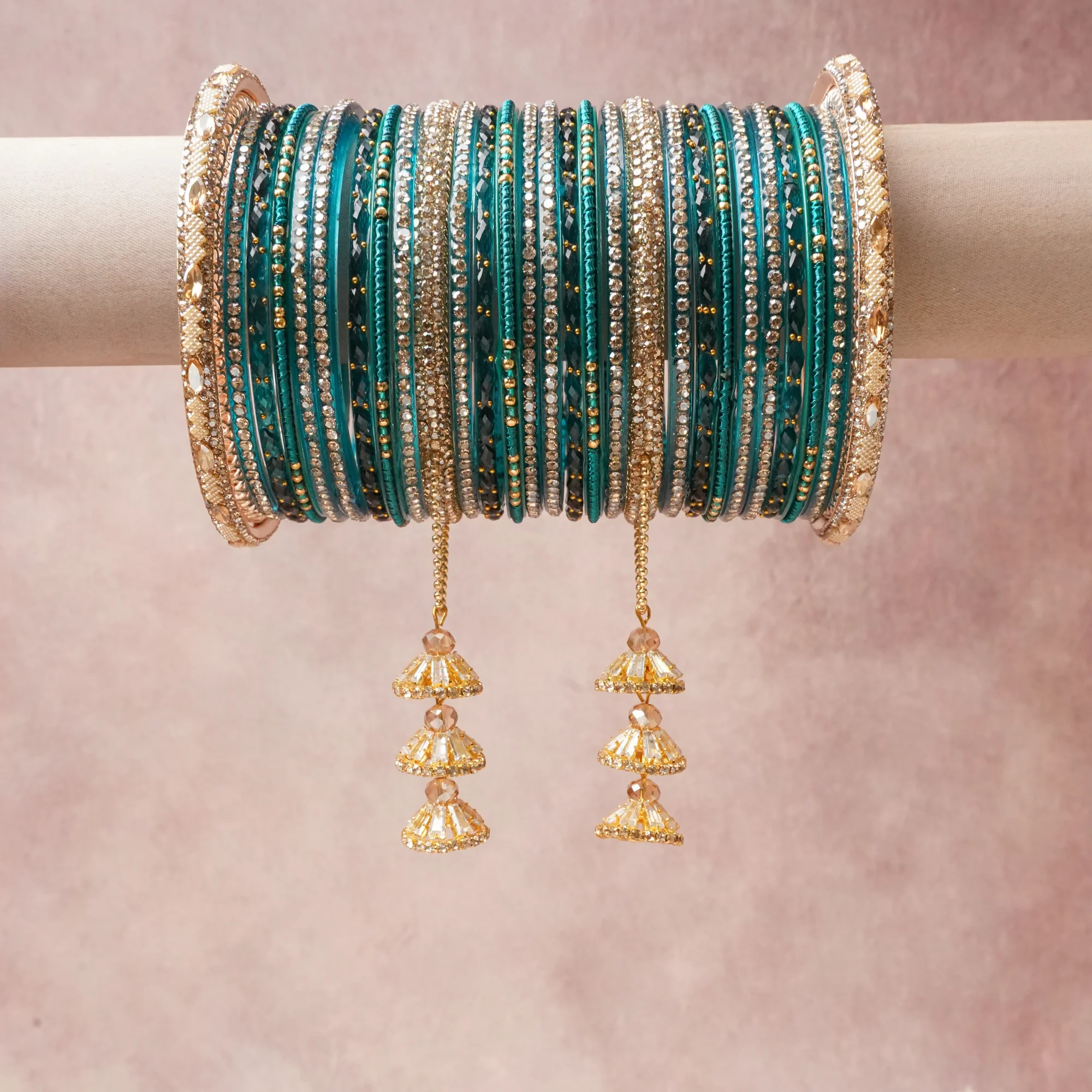 A commanding Teal anchors this beautiful set, enriched with accents of Amber, Clear, Gold that add depth and dimension.

Featuring a striking composition of Glass, Gold-toned Metal, Synthetic Crystal, Seed Beads, Thread, this set carries intricate craftsmanship and strong presence. Grand in form, it is created for moments that deserve to be marked.